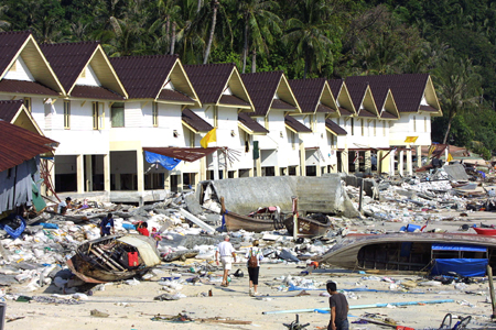 A row of terrace housing workers on the Phi Phi island in southern Thailand holiday resort were destroyed by a tidal waves 27 December 2004. An earthquake measuring 9.0 on the Richter scale struck off the coast of Sumatra, Indonesia, 26 December, and ensuing tsunami and aftershocks have claimed 17,200 lives in the south and southeast regions of Asia. AFP PHOTO/ROSLAN RAHMAN